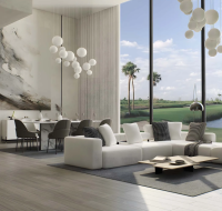 Living and dining area with golf course view through floor-to-ceiling windows
