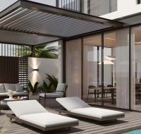 Outdoor lounge with sunbeds and poolside seating area