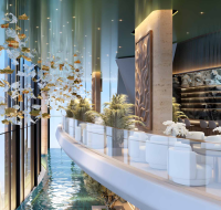 Vast indoor tropical park with palm trees, rope bridges, and elevated play structures.