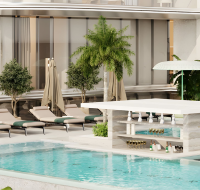 Modern poolside lounge with sunbeds and greenery