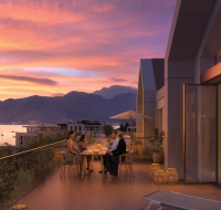 Elegant terrace dining at sunset with panoramic mountain and sea views