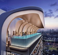 Infinity rooftop pool with architectural arches overlooking city skyline at sunset