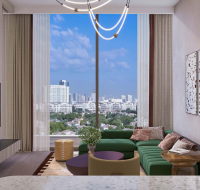 Outdoor evening setting with cozy furniture, palm trees, and a modern poolside atmosphere