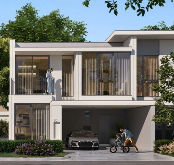 The exterior of a family townhouse in Vindera at The Valley, featuring a balcony and front garden.