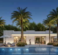 Resort-style community amenity building with a visible gym interior and an outdoor pool deck.