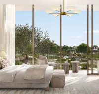 Contemporary master bedroom featuring a large bed, minimalist furniture, and a private balcony overlooking the community green spaces.