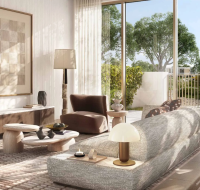 Modern living room with a neutral-toned sofa, contemporary furniture, and large windows opening to a private garden.