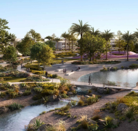 Scenic community park at Vindera at The Valley, featuring walking trails, a stream, and a pond.