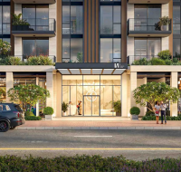 Entrance of a modern residential building with landscaped greenery and retail shops