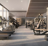 Modern indoor gym with cardio machines and strength training equipment