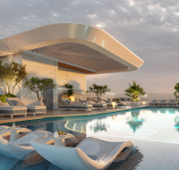 Infinity pool at Woodland Crest with sunset backdrop