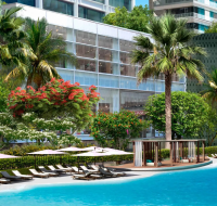 A rendering of a communal wellness area, with modern seating and peaceful ambiance, designed for resident relaxation.